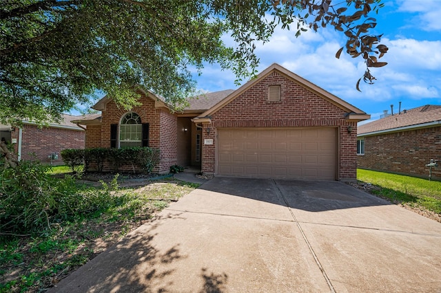 ranch-style home featuring concrete driveway, a garage, and brick siding