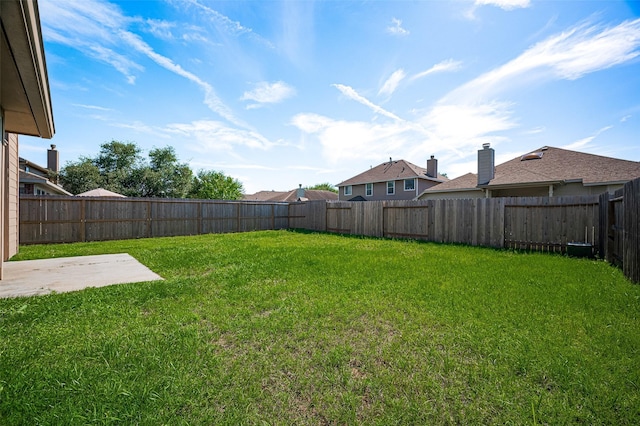 view of yard featuring a patio and a fenced backyard