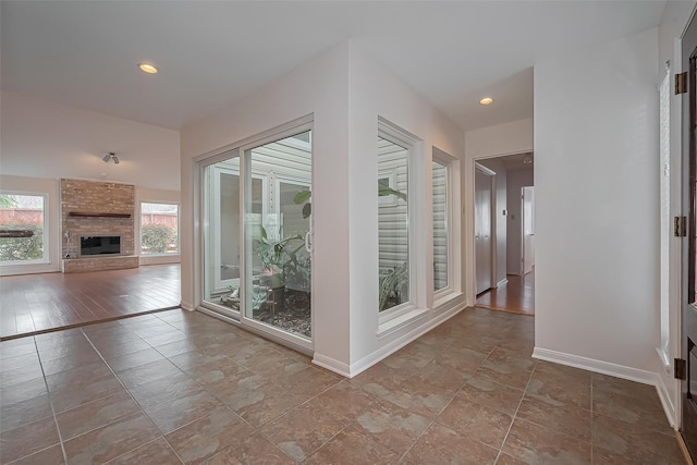 interior space featuring baseboards and recessed lighting