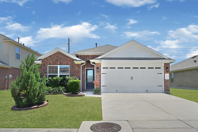 single story home with brick siding, a front yard, concrete driveway, and a garage