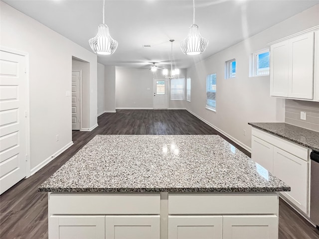 813 Apple Blossom Dr, La Marque, TX 77568 - kitchen featuring white cabinets, dark wood-style flooring, light stone countertops, and ceiling fan