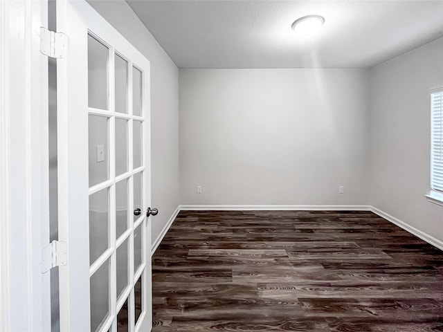 813 Apple Blossom Dr, La Marque, TX 77568 - unfurnished room featuring baseboards and dark wood-style floors