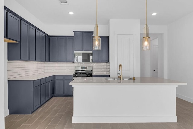8251 Red Shiner Way, Fulshear, TX 77441 - kitchen featuring stainless steel range with gas cooktop, decorative backsplash, light countertops, pendant lighting, and recessed lighting