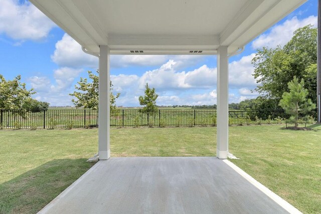 8251 Red Shiner Way, Fulshear, TX 77441 - fenced backyard featuring a patio