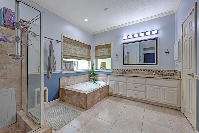 7551 Basswood Forest Ct, Houston, TX 77095 - full bathroom featuring crown molding, a shower stall, a garden tub, a textured ceiling, and double vanity