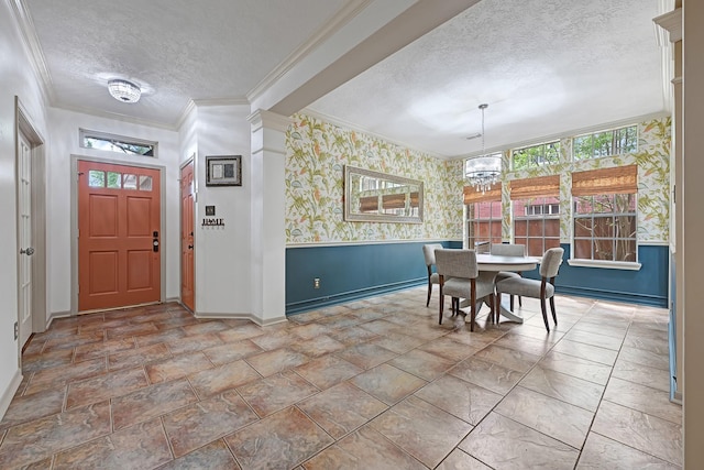 7551 Basswood Forest Ct, Houston, TX 77095 - entryway with a textured ceiling, baseboards, a chandelier, wallpapered walls, and crown molding
