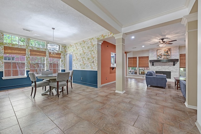 7551 Basswood Forest Ct, Houston, TX 77095 - dining room featuring baseboards, ceiling fan, a fireplace, a chandelier, and ornamental molding