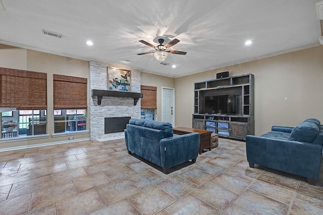 7551 Basswood Forest Ct, Houston, TX 77095 - living room with a ceiling fan, recessed lighting, ornamental molding, a fireplace, and stone finish flooring
