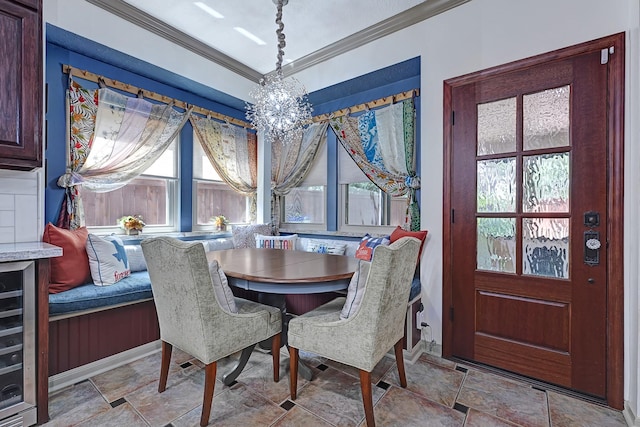 7551 Basswood Forest Ct, Houston, TX 77095 - dining room with ornamental molding, plenty of natural light, wine cooler, a chandelier, and stone finish floors