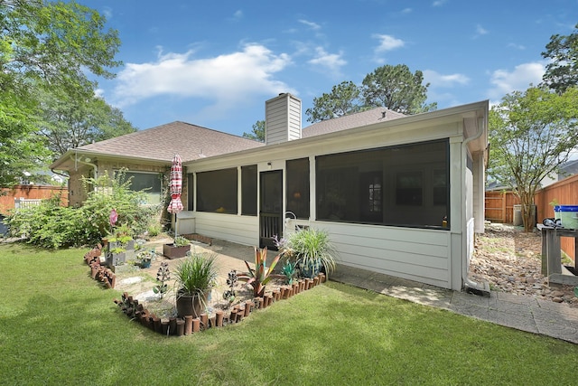7551 Basswood Forest Ct, Houston, TX 77095 - back of house featuring a sunroom, a shingled roof, and a chimney