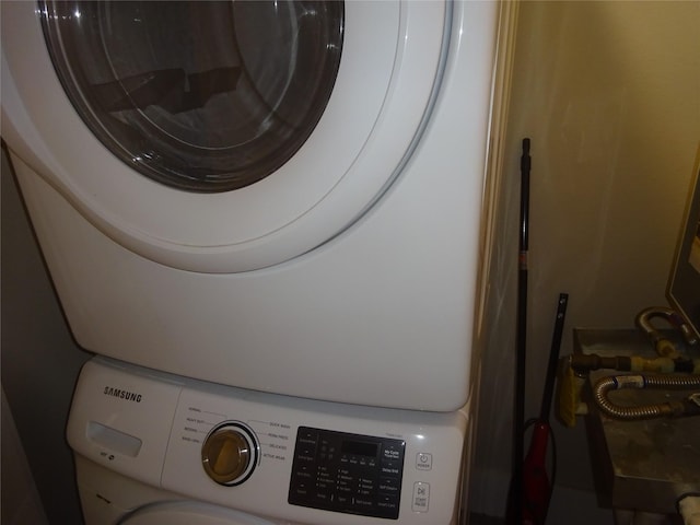 2401 Crawford Unit 105, Houston, TX 77004 - laundry area with stacked washer / drying machine