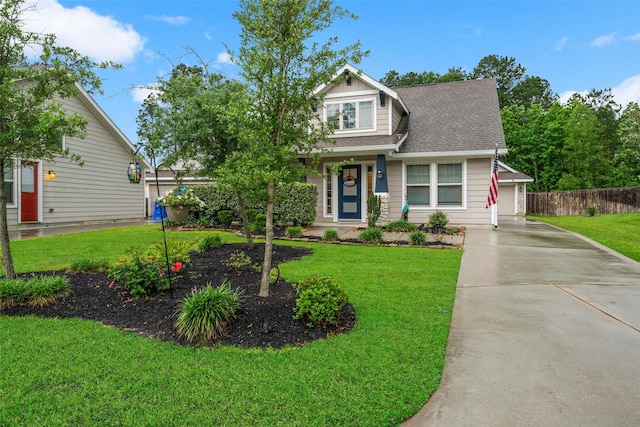 257 N Lynx Trl, Montgomery, TX 77316 - craftsman house featuring a shingled roof, a front lawn, and fence
