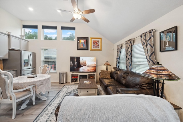 257 N Lynx Trl, Montgomery, TX 77316 - living room with vaulted ceiling, ceiling fan, and light wood finished floors