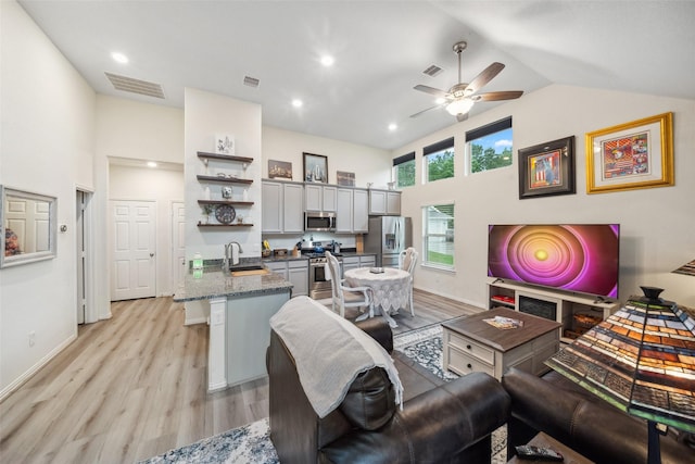 257 N Lynx Trl, Montgomery, TX 77316 - living room with ceiling fan, light wood finished floors, and visible vents