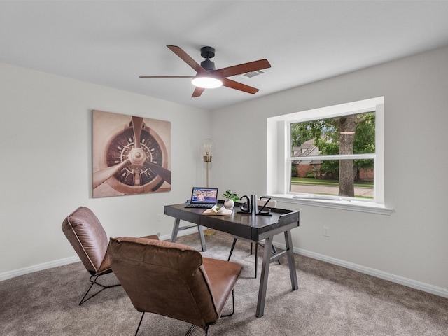 office space featuring carpet flooring, visible vents, baseboards, and ceiling fan