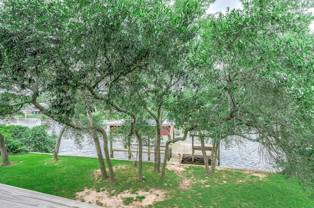 exterior space with a lawn and a water view