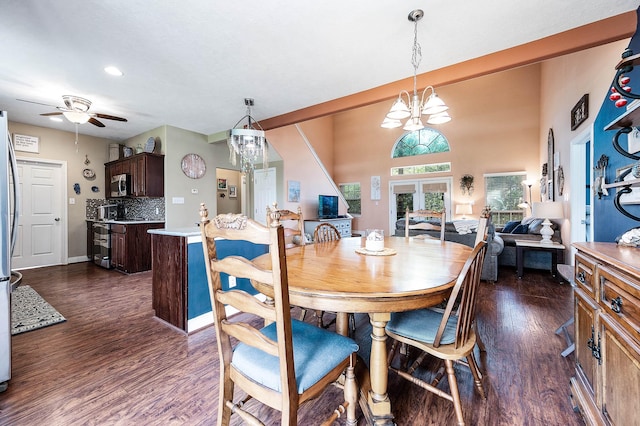 dining room featuring dark wood-type flooring, ceiling fan with notable chandelier, and recessed lighting