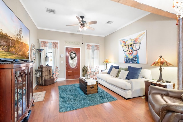 311 Depot St, Dayton, TX 77535 - living room featuring ceiling fan, wood finished floors, visible vents, and a wealth of natural light