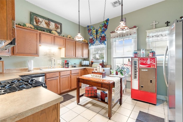 311 Depot St, Dayton, TX 77535 - kitchen with a sink, decorative light fixtures, visible vents, light countertops, and light tile patterned floors