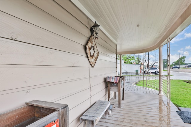 311 Depot St, Dayton, TX 77535 - wooden terrace featuring a yard and a porch