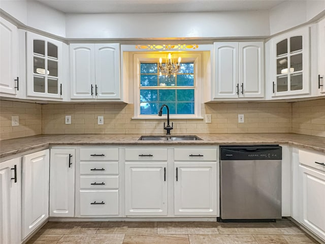 kitchen with a sink, decorative backsplash, light stone counters, and dishwasher