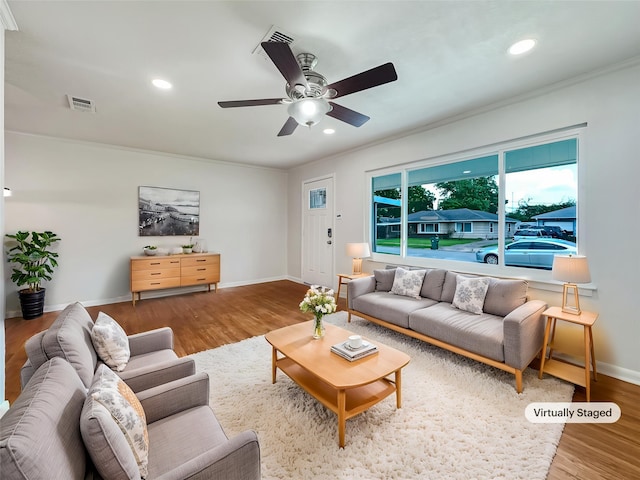 living room with baseboards, recessed lighting, visible vents, and wood finished floors