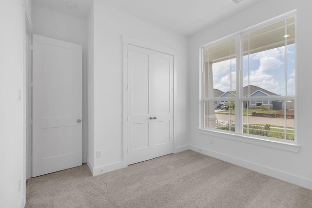 8114 Red Shiner Way, Fulshear, TX 77441 - unfurnished bedroom featuring carpet flooring and baseboards