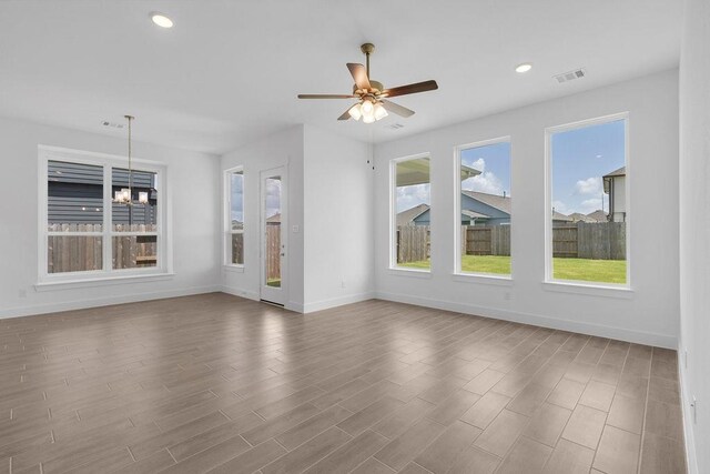 8114 Red Shiner Way, Fulshear, TX 77441 - unfurnished living room featuring ceiling fan, wood finished floors, and recessed lighting