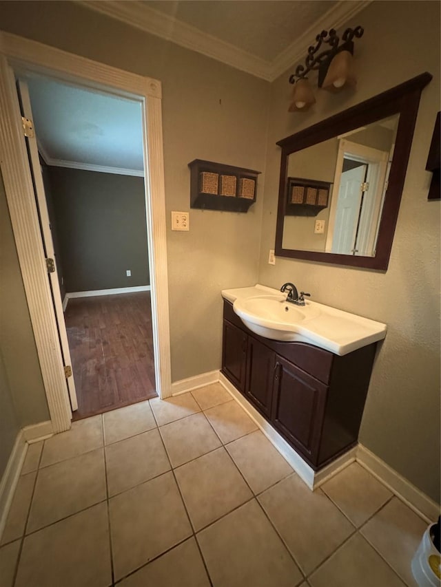 805 Dugas St, Bridge City, TX 77611 - bathroom featuring baseboards, vanity, and crown molding