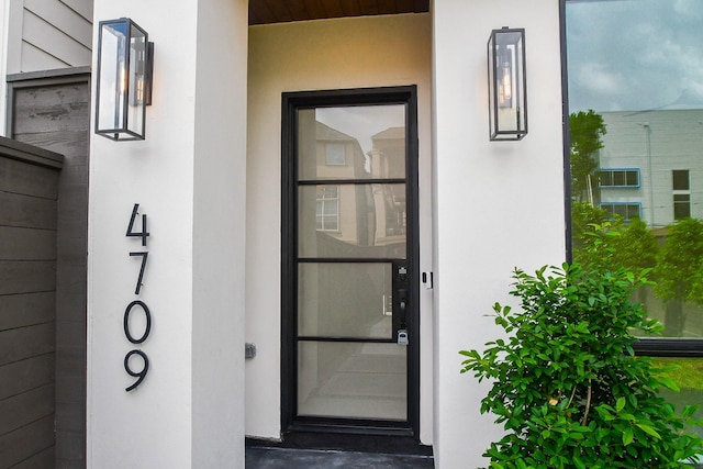 4709 Gibson St, Houston, TX 77007 - doorway to property featuring stucco siding