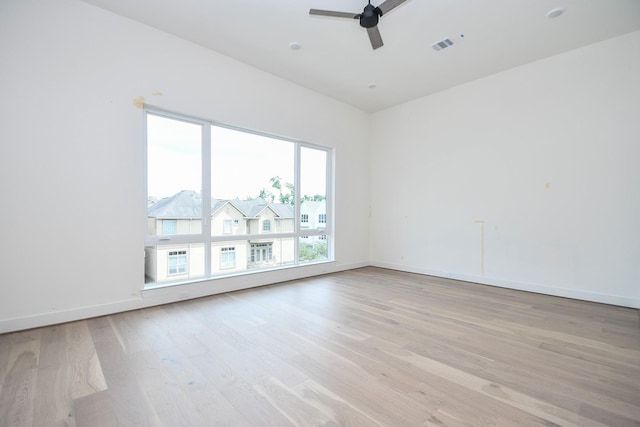 4709 Gibson St, Houston, TX 77007 - empty room with light wood-style floors, a ceiling fan, and baseboards