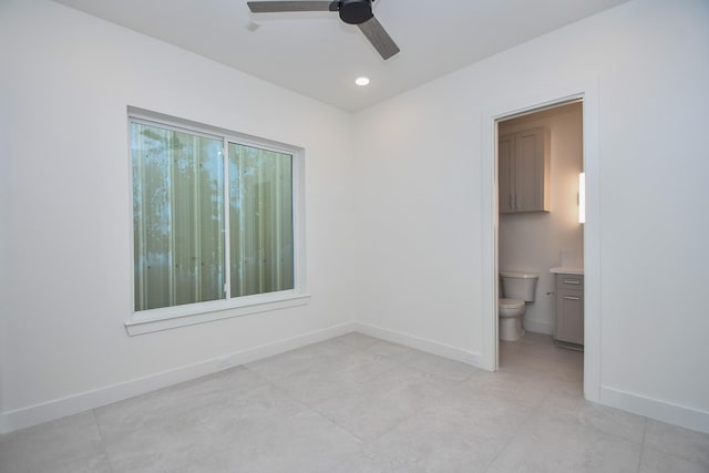 4709 Gibson St, Houston, TX 77007 - unfurnished bedroom with baseboards, connected bathroom, light tile patterned flooring, and recessed lighting
