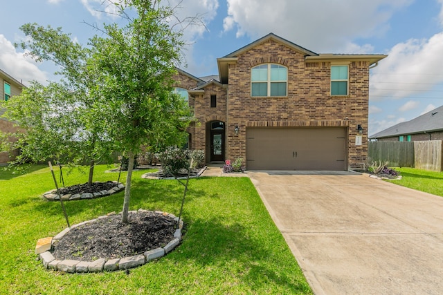 traditional-style house with a garage, fence, concrete driveway, a front lawn, and brick siding