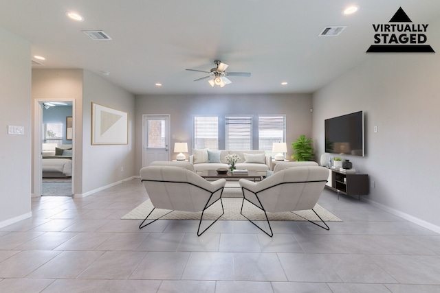living room featuring visible vents, baseboards, ceiling fan, light tile patterned flooring, and recessed lighting