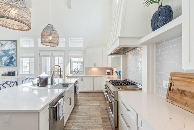 201 Lakeshore St, Port Aransas, TX 78373 - kitchen featuring light countertops, tasteful backsplash, and appliances with stainless steel finishes