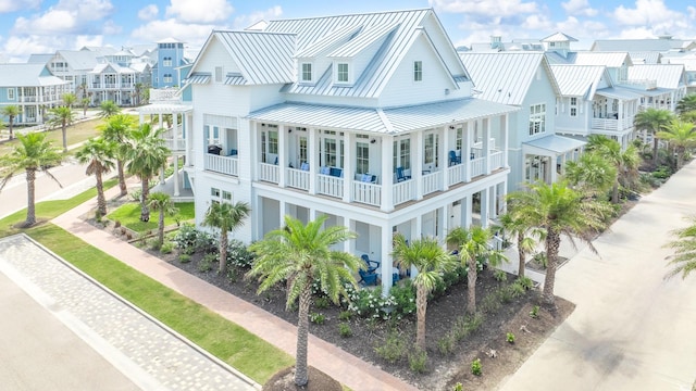 201 Lakeshore St, Port Aransas, TX 78373 - exterior space with a residential view, metal roof, and a balcony