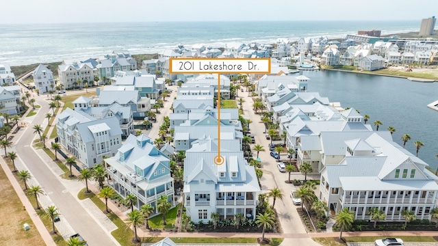 201 Lakeshore St, Port Aransas, TX 78373 - birds eye view of property featuring a water view and a residential view