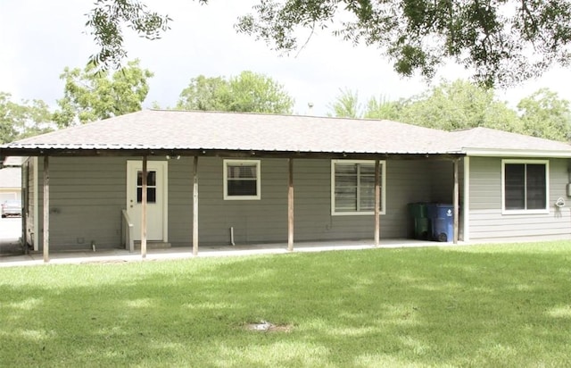 231 Moore St, Richwood, TX 77531 - back of property featuring a patio area and a lawn