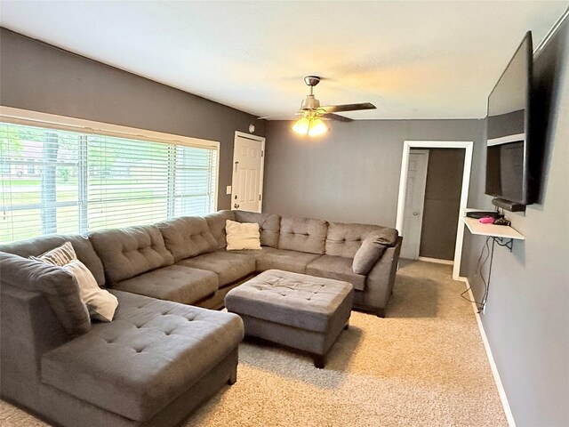 231 Moore St, Richwood, TX 77531 - living area with ceiling fan, light colored carpet, and baseboards