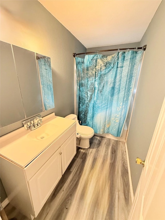 231 Moore St, Richwood, TX 77531 - bathroom featuring toilet, vanity, and wood finished floors