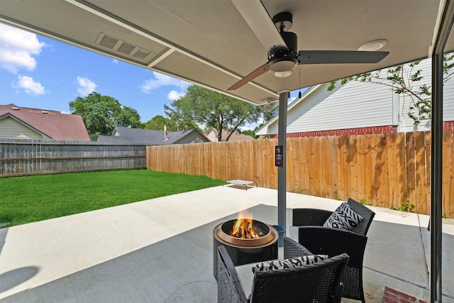 18730 Haughland Dr, Cypress, TX 77433 - view of patio with a fire pit, ceiling fan, and a fenced backyard