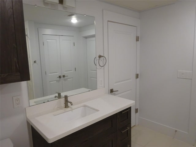 bathroom featuring vanity and baseboards