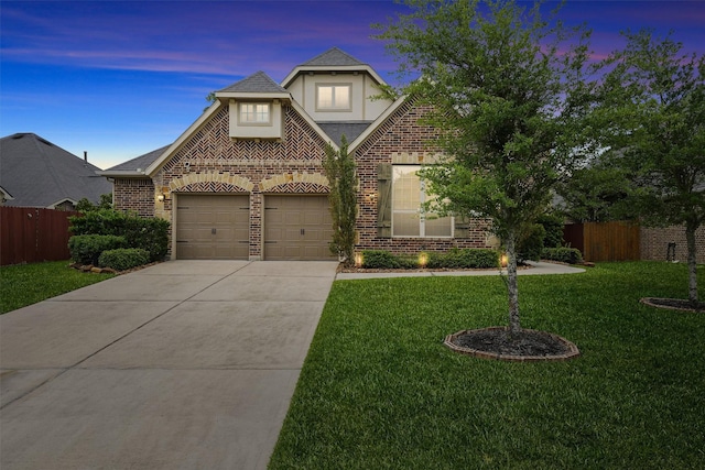 3743 Pinebrook Hollow Ln, Spring, TX 77386 - view of front of property featuring a yard, fence, brick siding, and concrete driveway