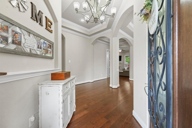 3743 Pinebrook Hollow Ln, Spring, TX 77386 - foyer featuring a notable chandelier, baseboards, ornamental molding, dark wood-type flooring, and arched walkways