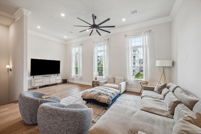 3606 Lannister Ln, Houston, TX 77055 - living area featuring healthy amount of natural light, wood finished floors, a ceiling fan, crown molding, and recessed lighting