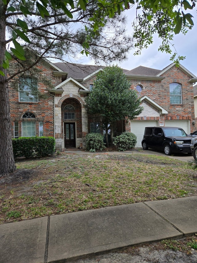 traditional home featuring brick siding and french doors