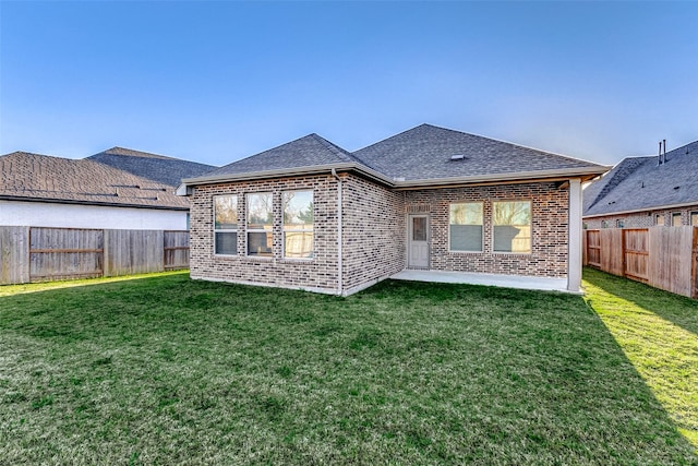 5110 Morrison Dr, Manvel, TX 77578 - rear view of property featuring a shingled roof and brick siding