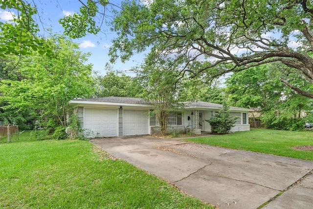 2310 Pecos St, La Marque, TX 77568 - single story home with an attached garage, concrete driveway, fence, and a front yard