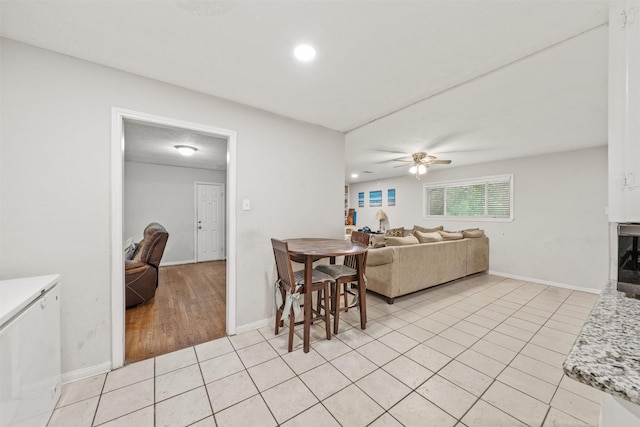 2310 Pecos St, La Marque, TX 77568 - dining room featuring light tile patterned flooring, baseboards, and a ceiling fan