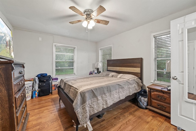 2310 Pecos St, La Marque, TX 77568 - bedroom with multiple windows, light wood-type flooring, and a ceiling fan